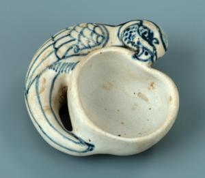 Lave pinceau en forme de perroquet et de pêche